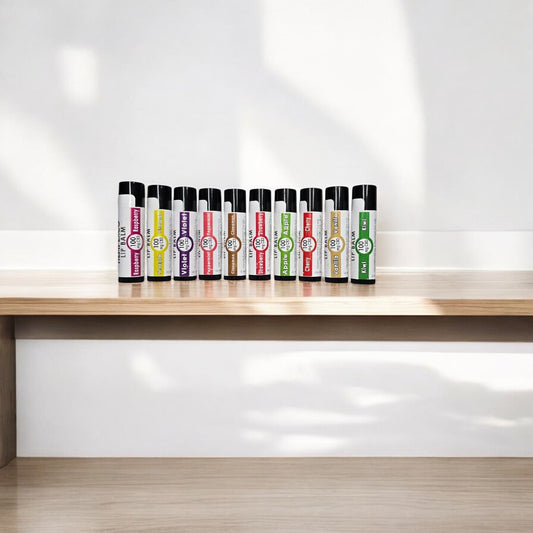 Group of Hempexco CBD lip balm standing up in a curve on a wooden table